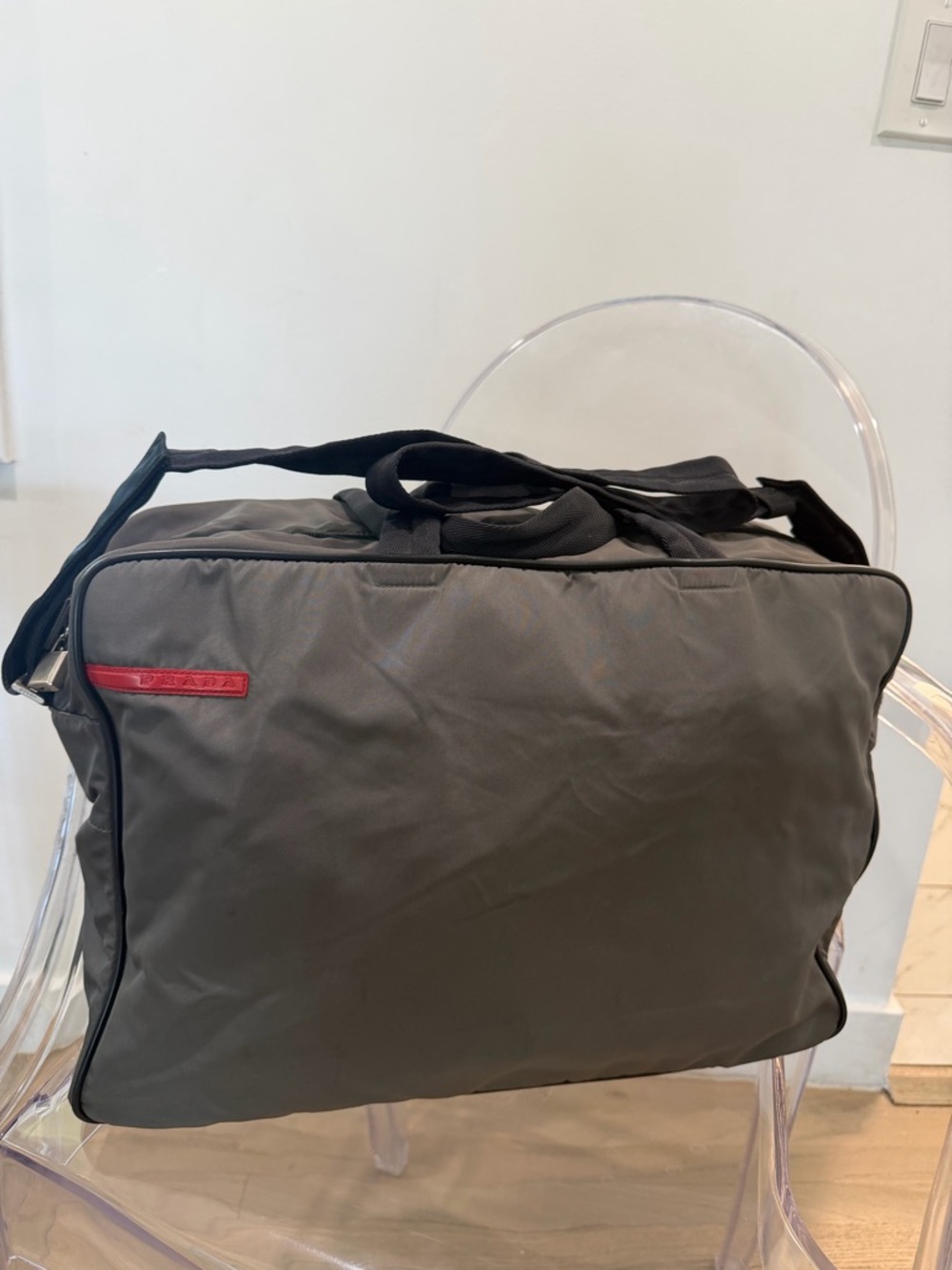 Authentic Vintage Prada Gray Nylon Travel Duffel Bag with Red rubber logo.